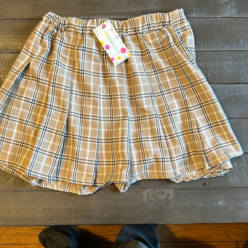 Urban kids , size large kids plaid skirt. Black white and beige